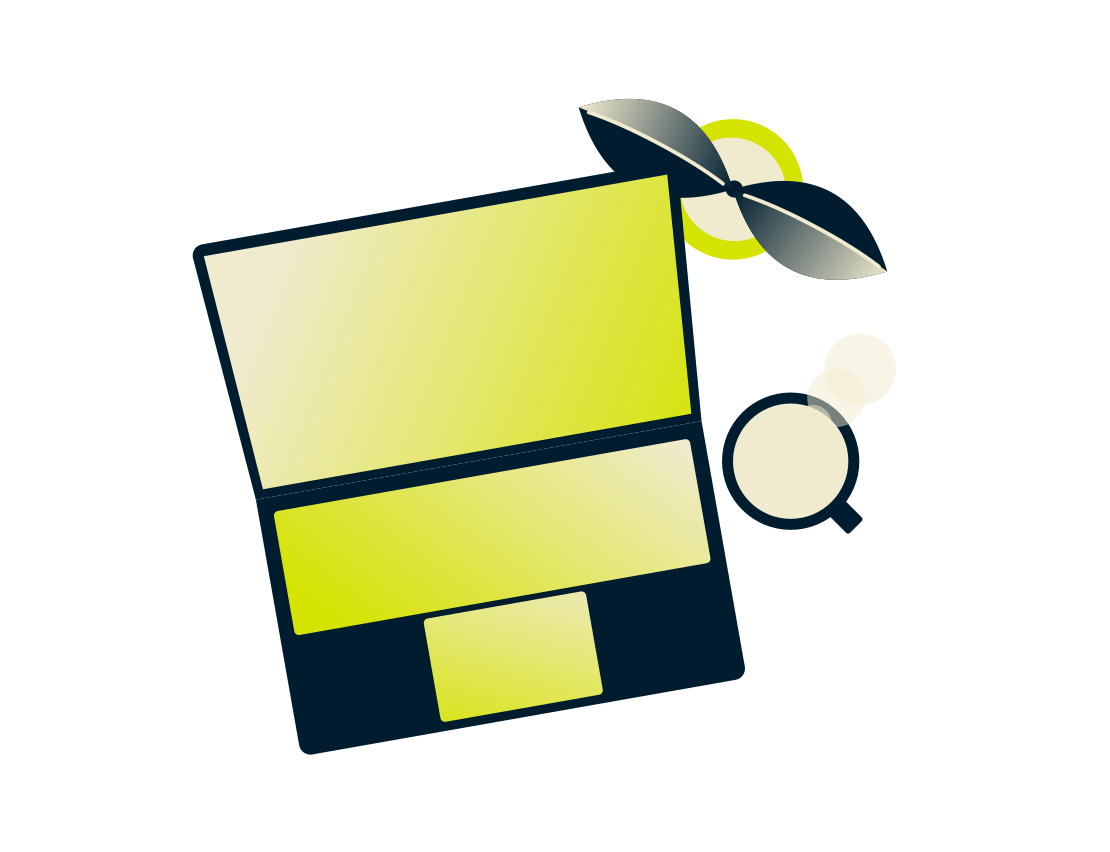 Laptop cu o plantă şi băutură.