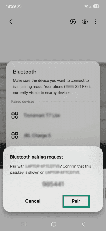 A Bluetooth pairing request on an Android phone. The "Pair" button is highlighted.