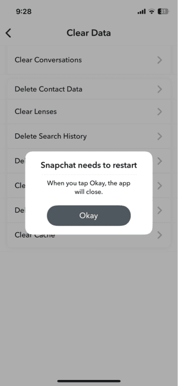 Snapchat app Snapchat needs to restart popup on iPhone over the Clear Data settings.